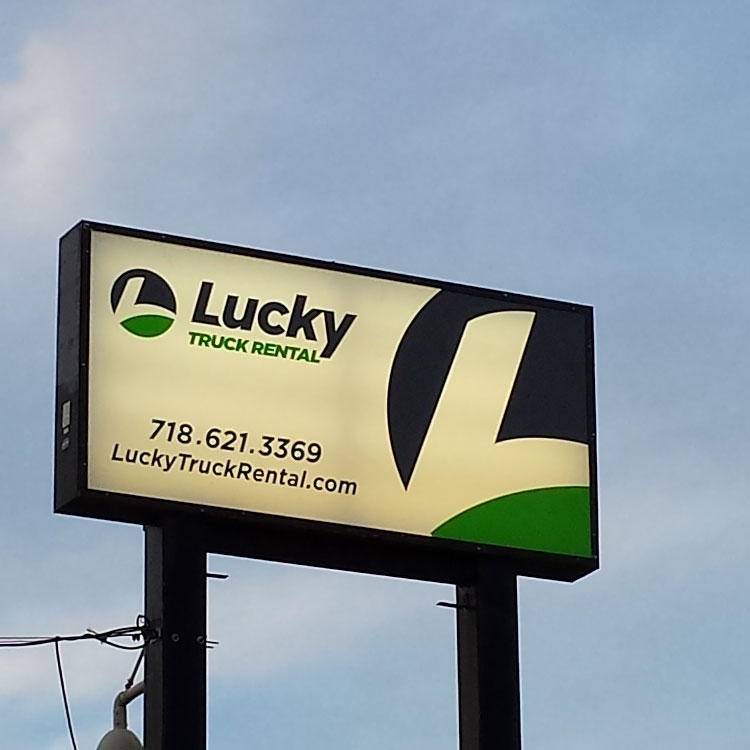 Lucky Truck Rental illuminated pylon sign